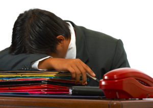 overloaded employee napping
